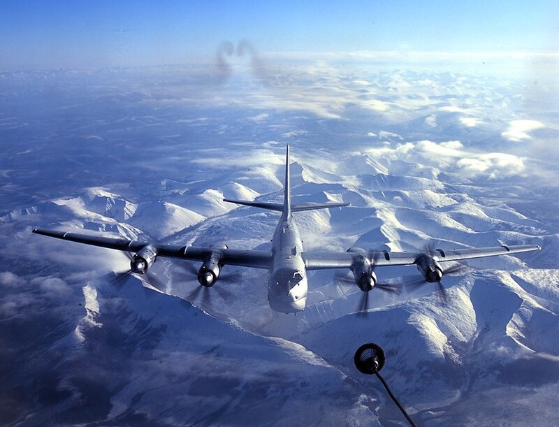 B-36 bomber over snowy mountains