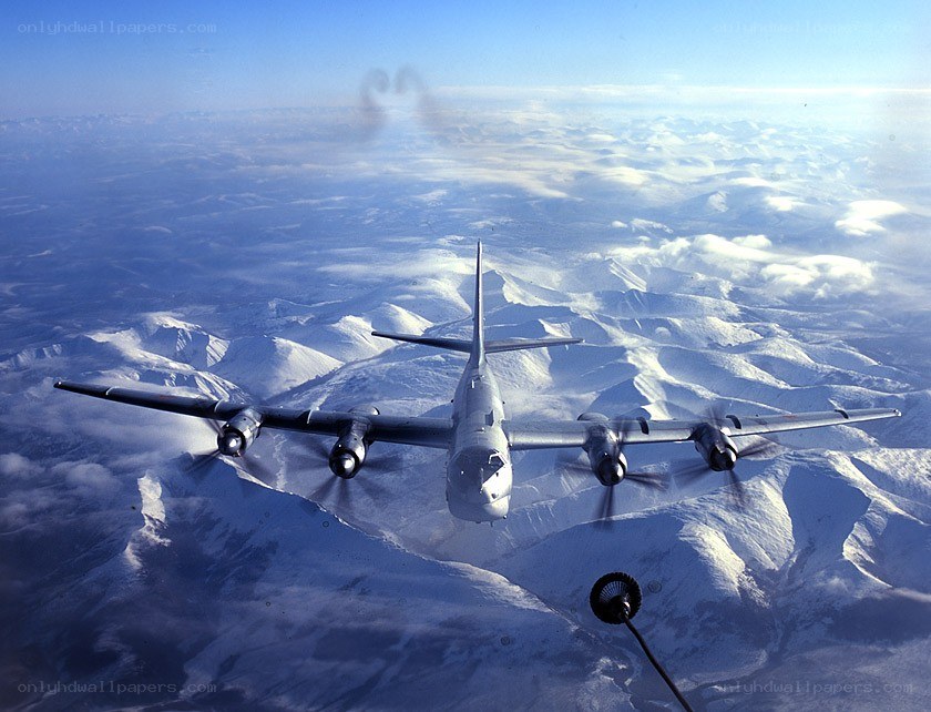 B-36 bomber over snowy mountains
