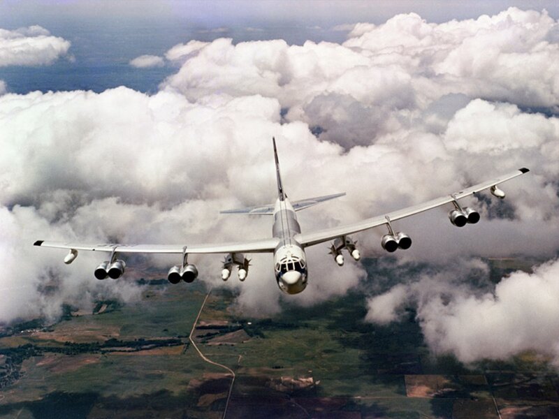 B-52 bomber flying above clouds