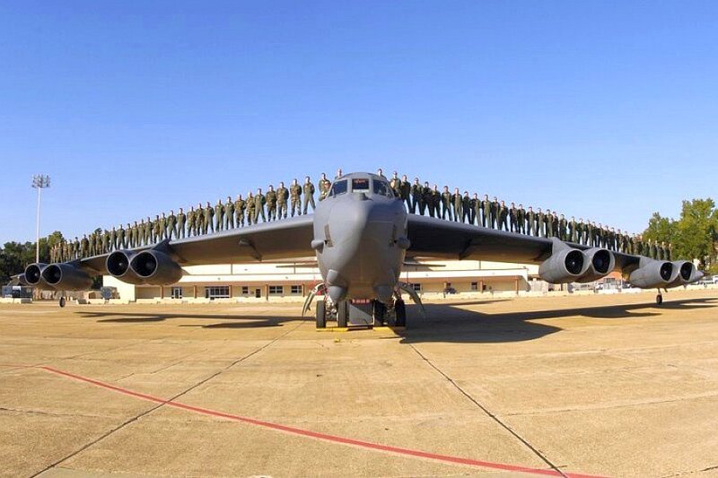 B-52 bomber with crew on wings