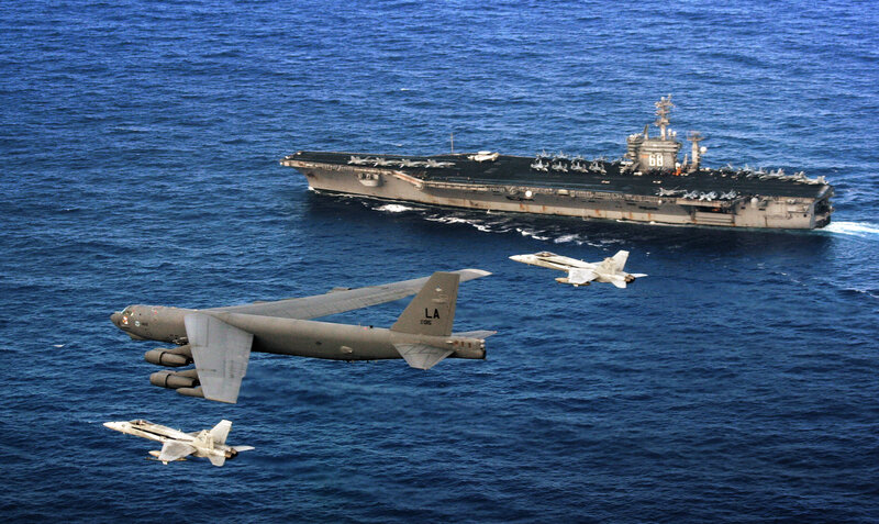 B-52 with fighter escorts near carrier