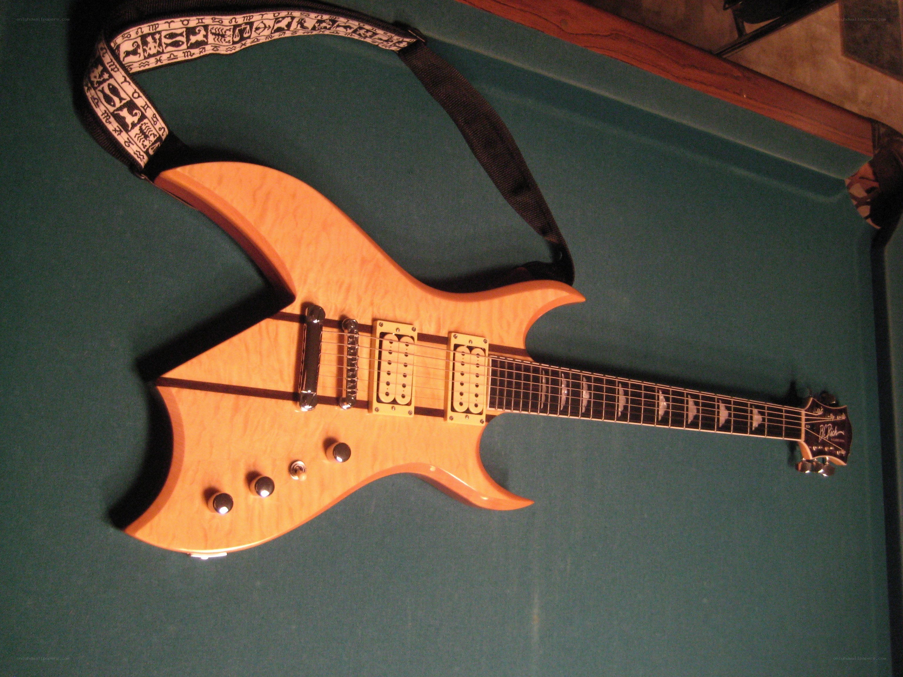 B.C. Rich guitar on pool table