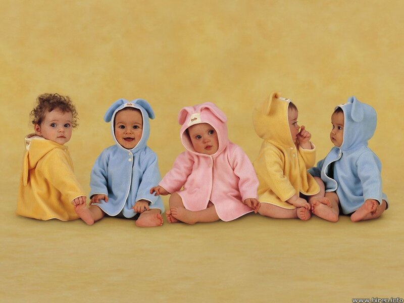 babies in colorful hooded outfits