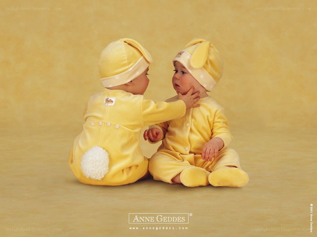 Babies in yellow bunny suits
