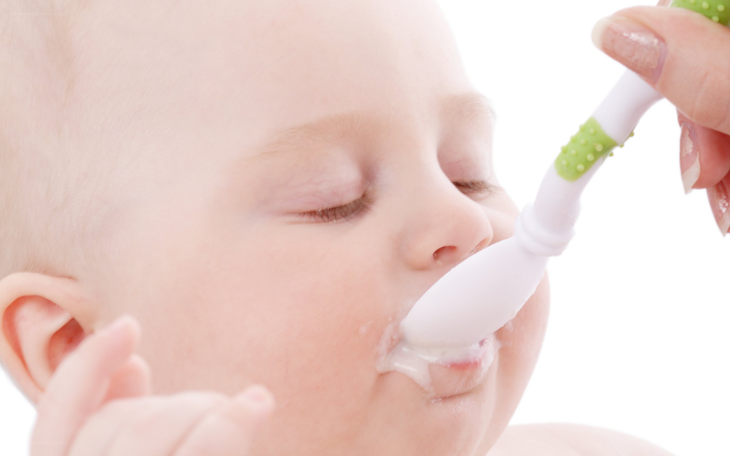 Baby being fed with a spoon
