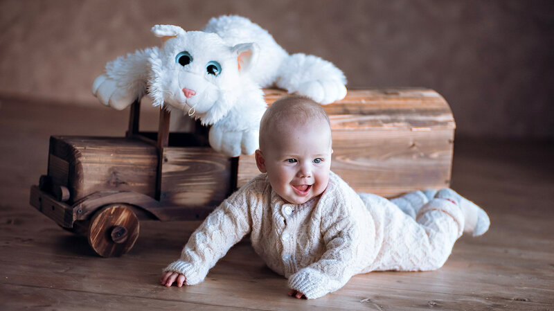 Baby Crawling on Floor — White, Playful