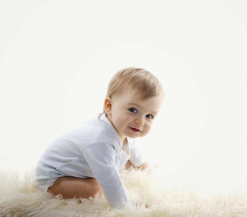 Baby Crawling on Rug — White