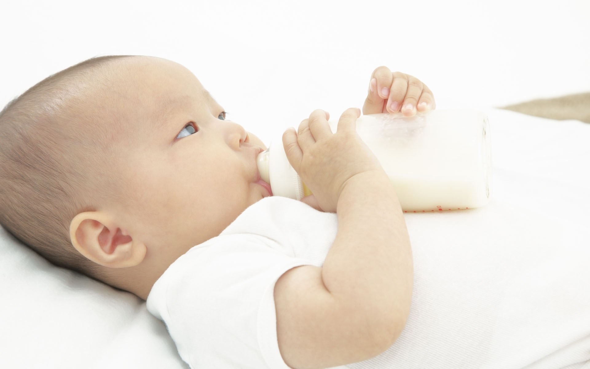 baby drinking from bottle