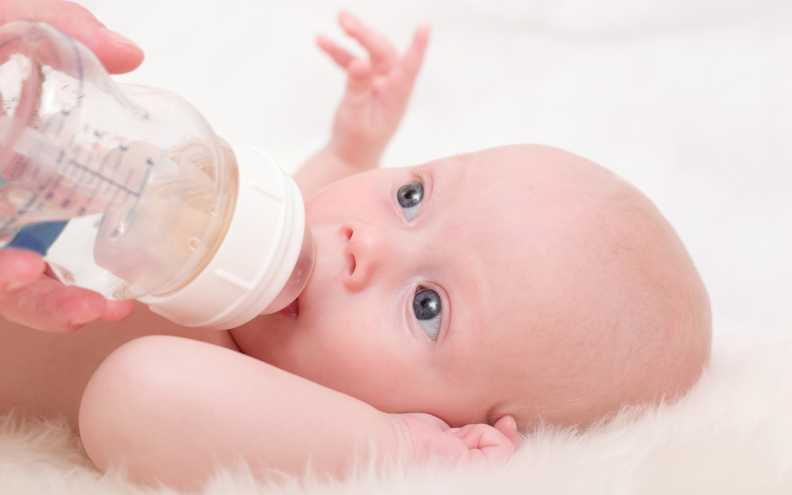 baby drinking from bottle