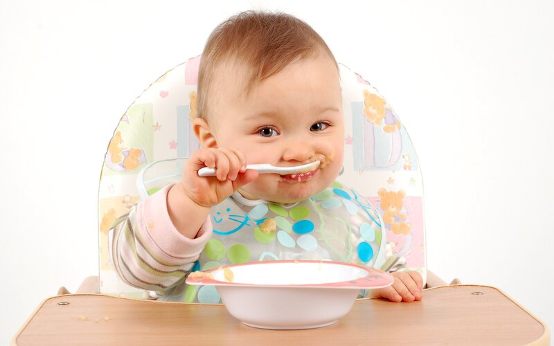 Baby eating from a bowl