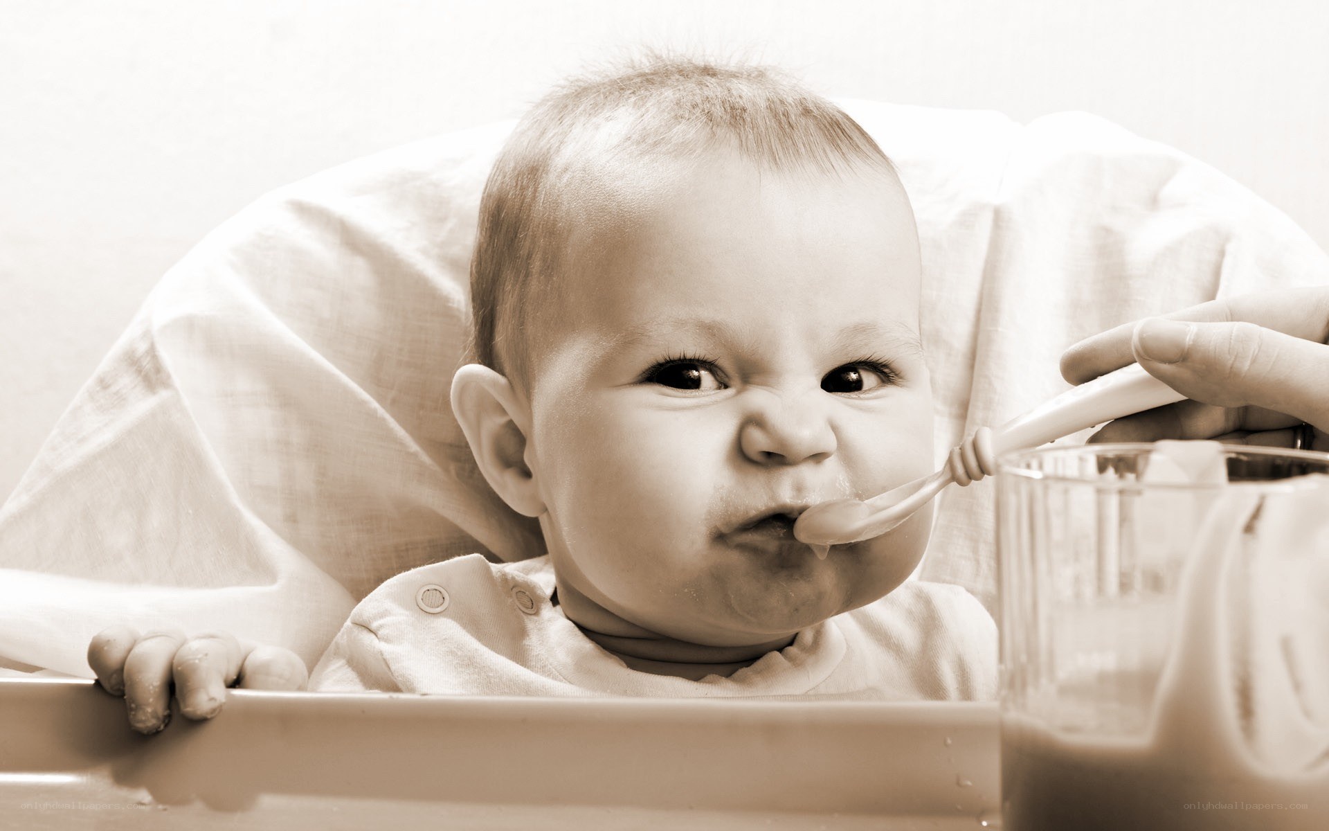 baby eating from a spoon