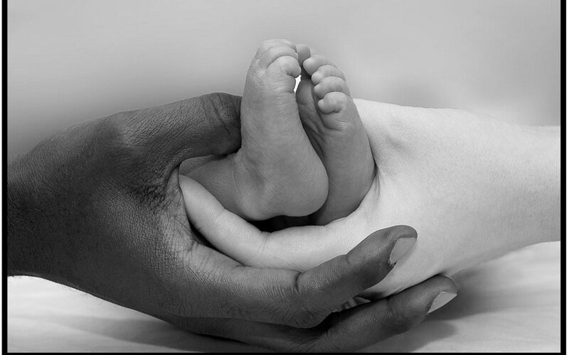 Baby Feet in Adult Hands — Black, Calm
