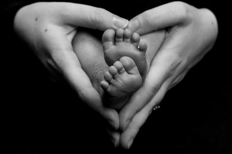 Baby Feet in Hands — Black