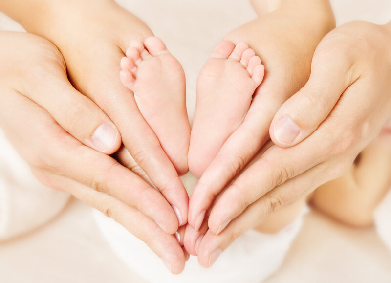 Baby Feet in Hands — White