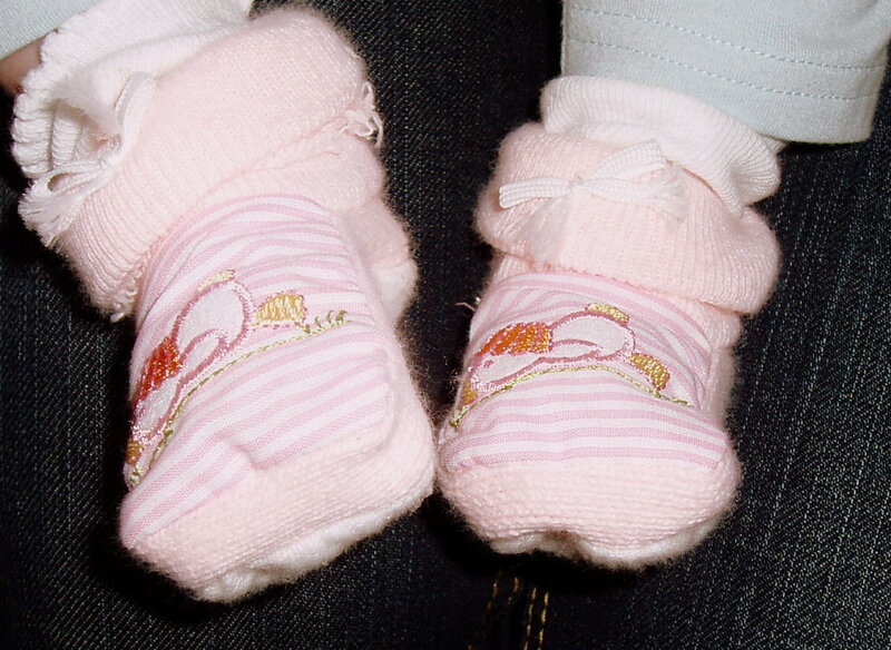 Baby feet in pink booties