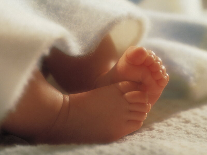 Baby Feet under Blanket — White