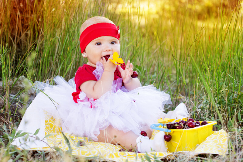 Baby Girl Eating Cherries