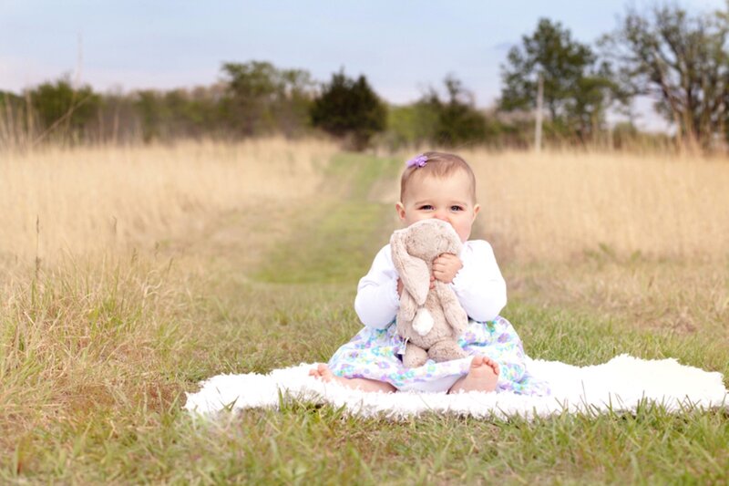 Baby Girl Holding Bunny