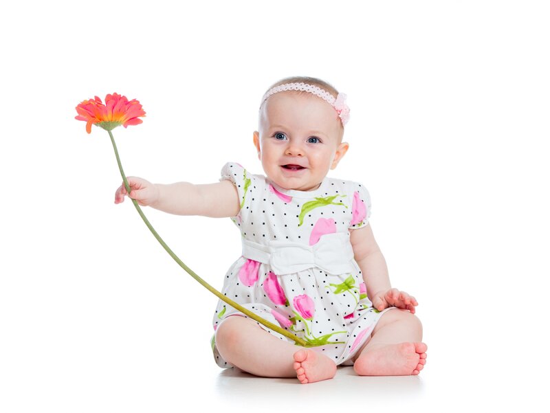 Baby Girl Holding Flower