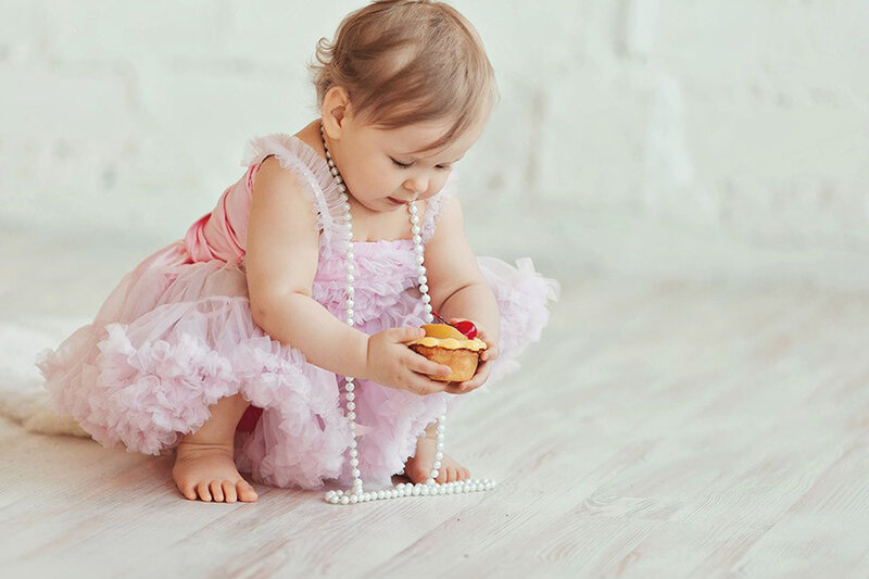 Baby Girl in Pink Dress — Calm, Photograph, Cupcake