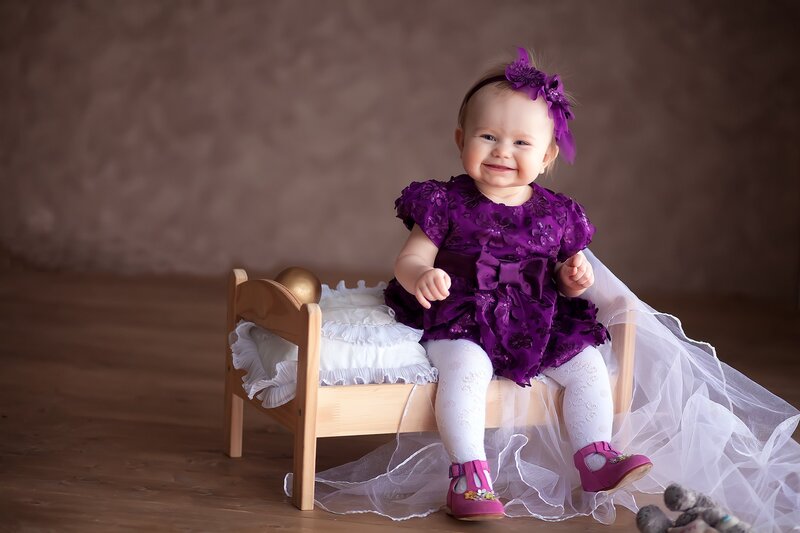 Baby Girl in Purple Dress