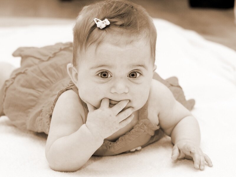 Baby Girl Lying Down — Brown
