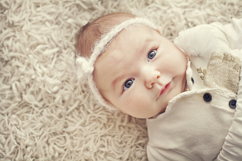 Baby Girl Lying Down — White, Calm