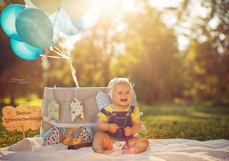 Baby Girl Sitting on Blanket