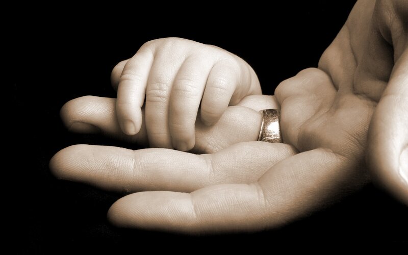 Baby Hand Holding Adult Hand — Sepia, Intimate