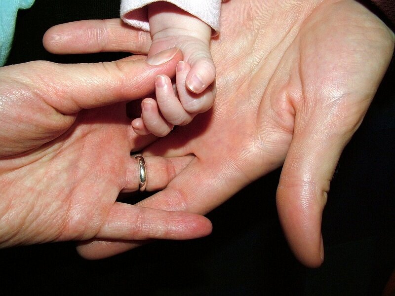 Baby Hand Holding Adult Hands