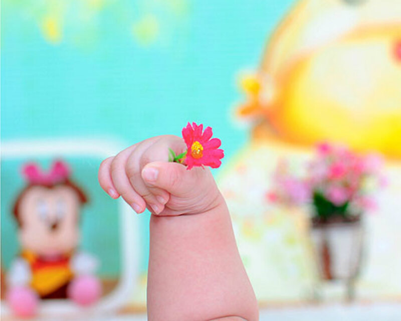Baby Hand Holding Flower