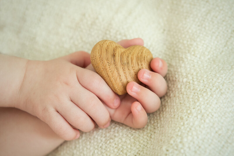 Baby Hands Holding Heart