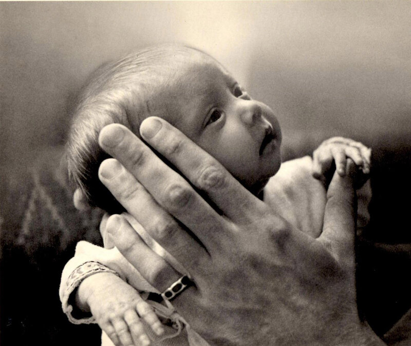 Baby Held by Adult Hand