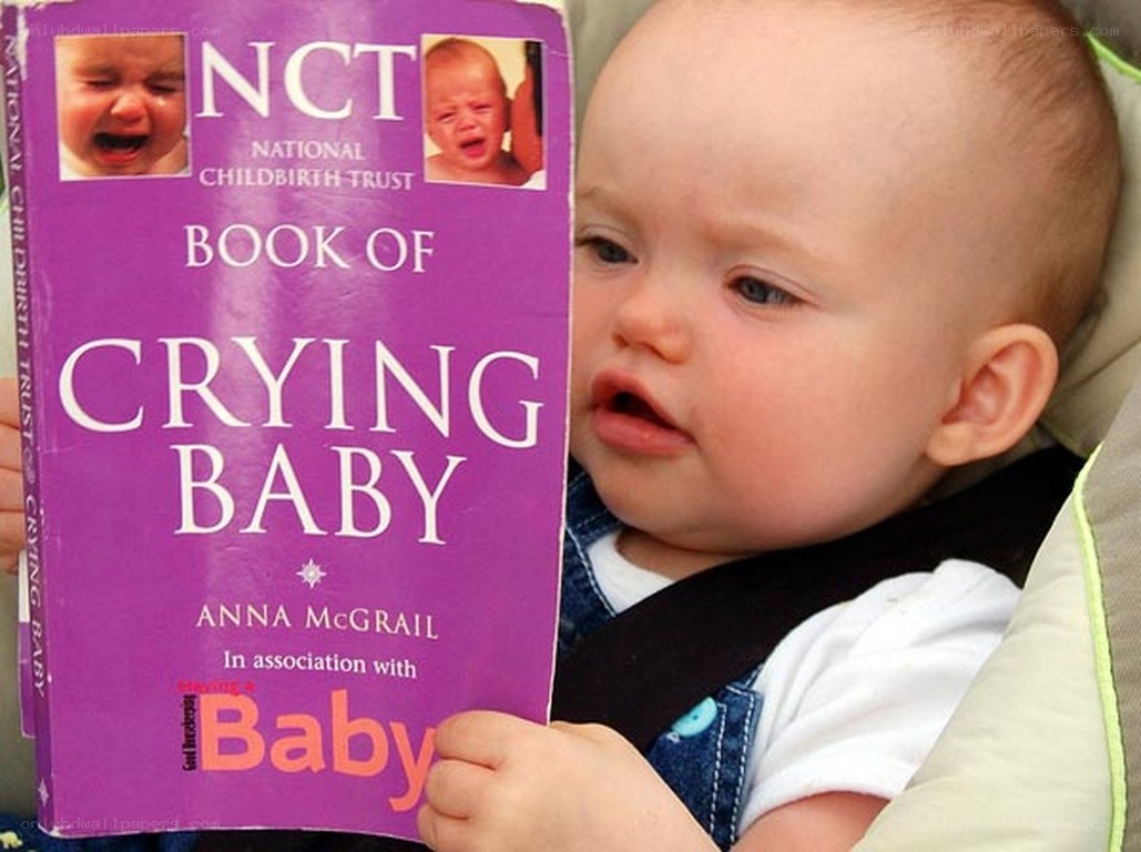 Baby holding book about crying