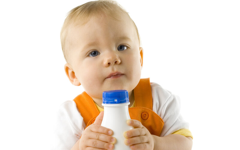 Baby Holding Bottle