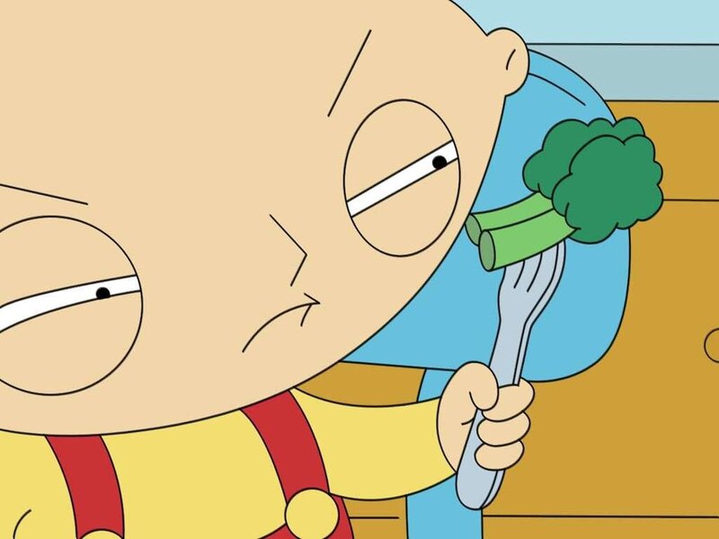 Baby Holding Broccoli
