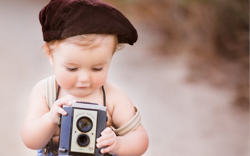 Baby Holding Camera