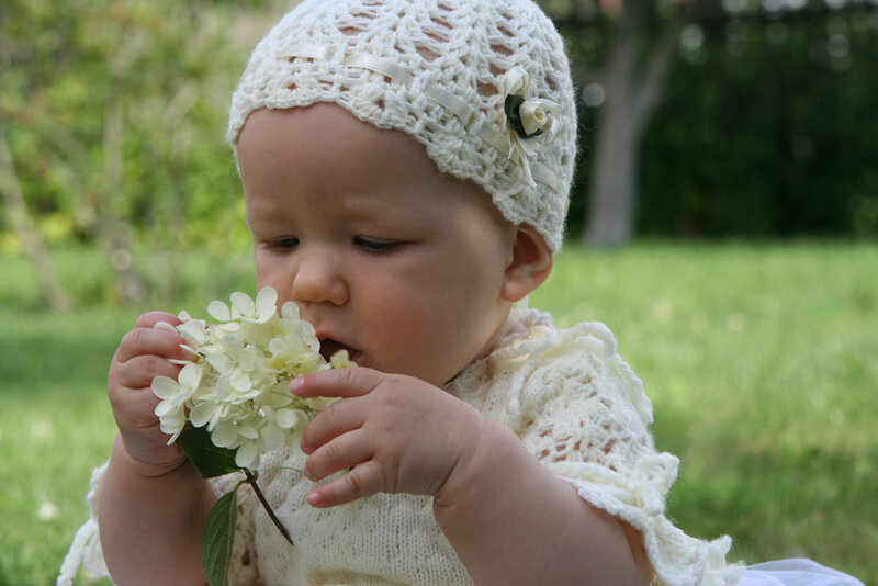 Baby Holding Flowers
