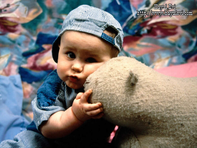 Baby Holding Stuffed Animal
