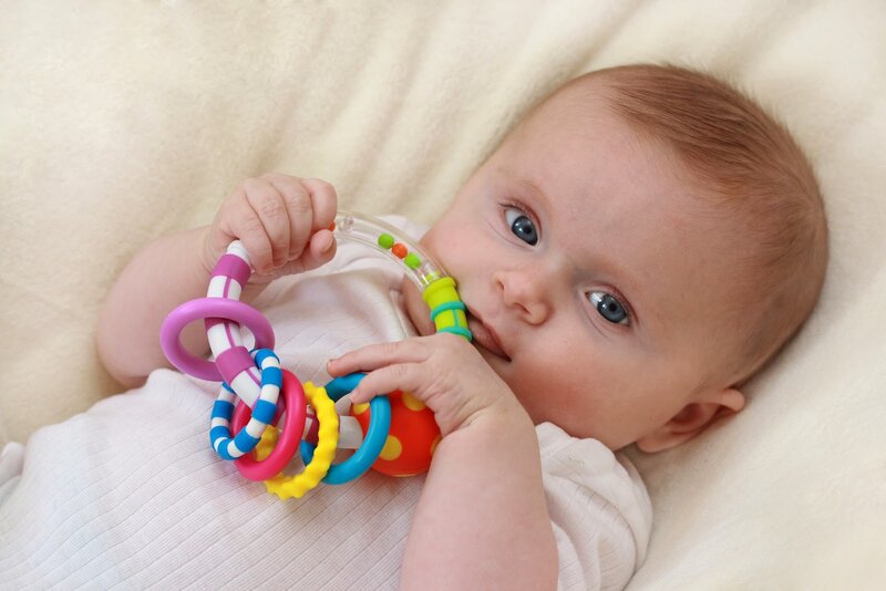 Baby Holding Toy