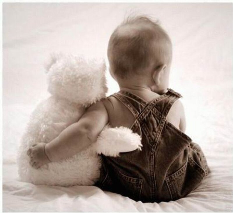 Baby Hugging Teddy Bear