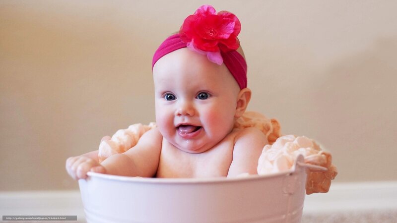 Baby in a bucket with flower headband