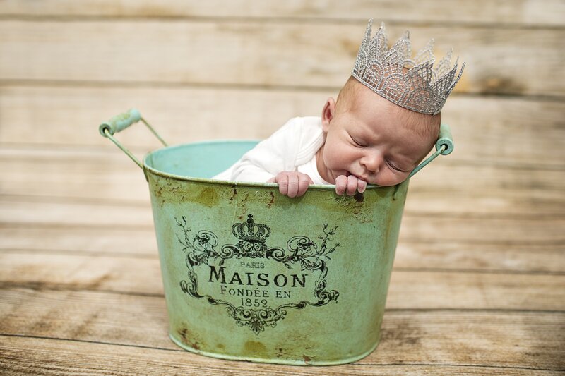 Baby in a crown bucket