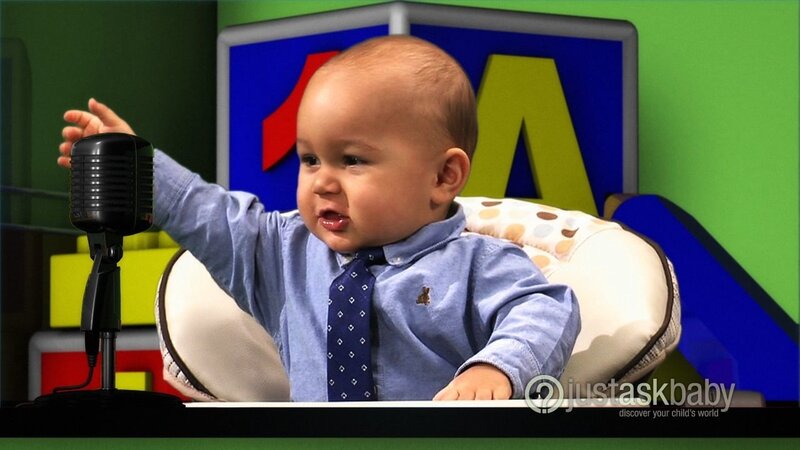 Baby in a tie at a microphone