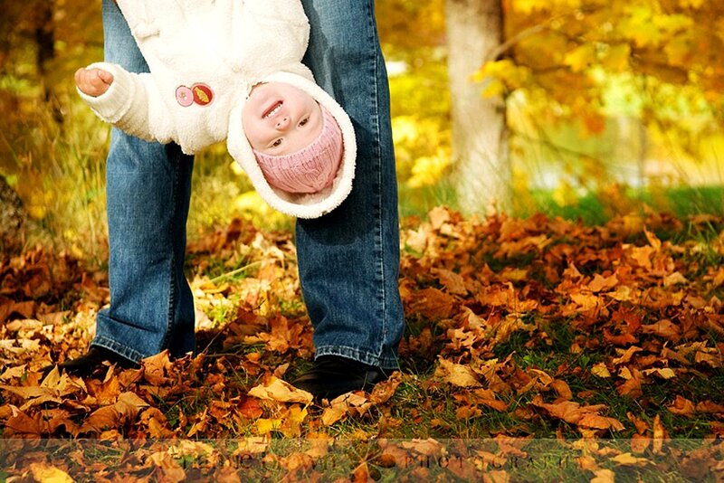 Baby in autumn leaves