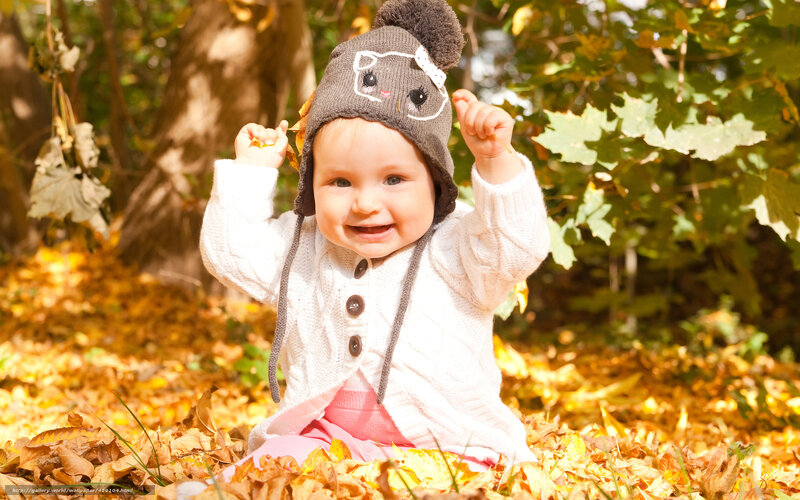 Baby in Autumn Leaves — Yellow, Joyful, Photograph
