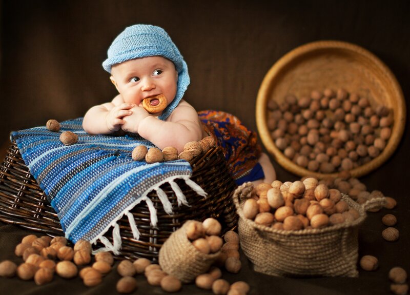Baby in Basket with Nuts