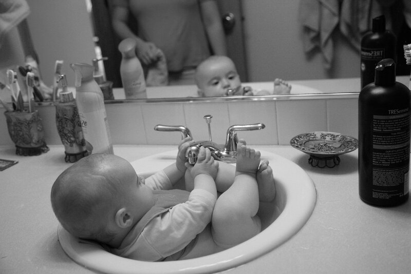 Baby in Bathroom Sink — Black
