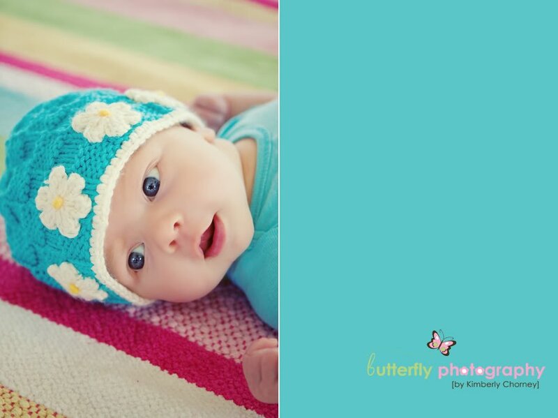 baby in blue hat with flowers