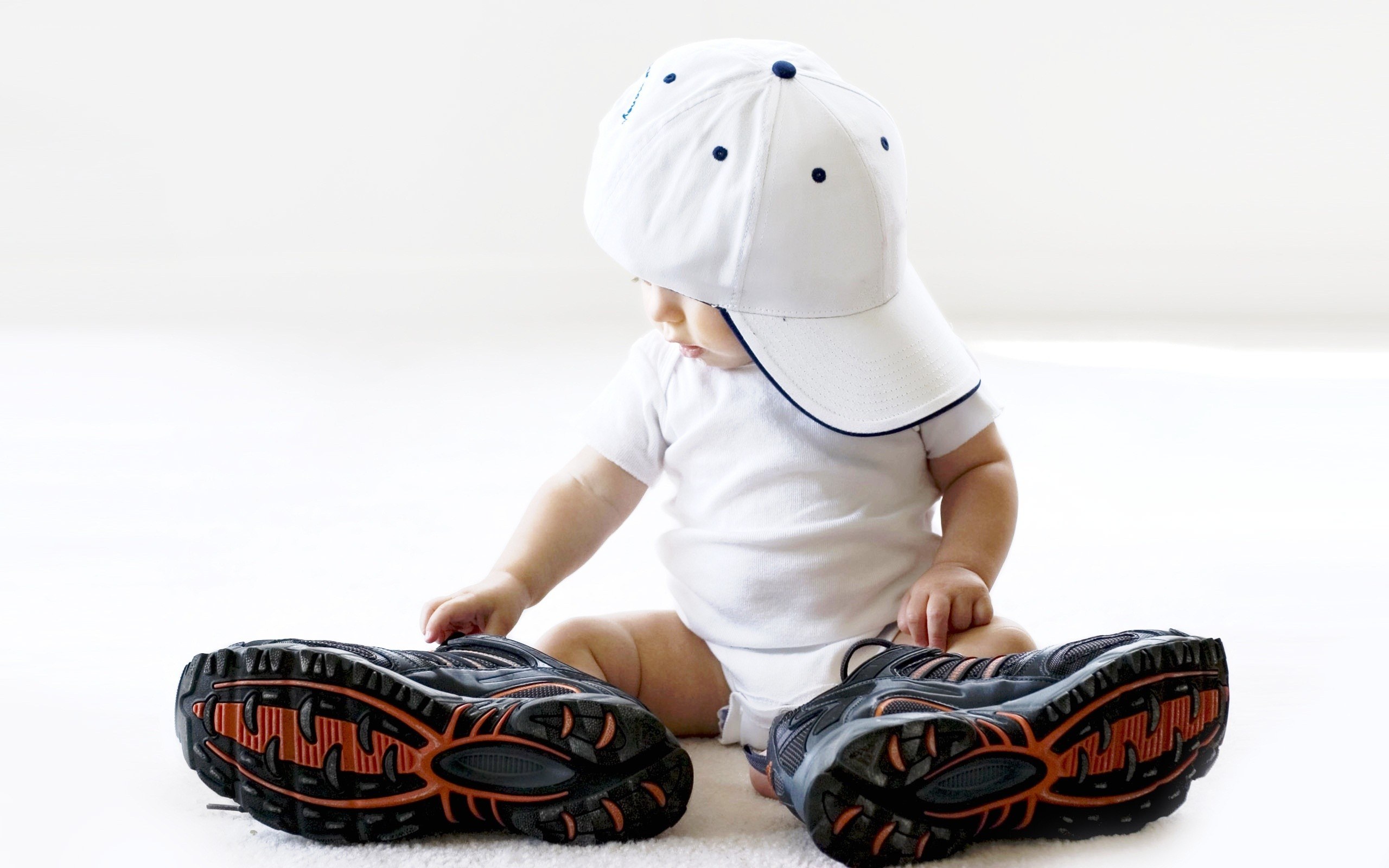 Baby in cap and sneakers
